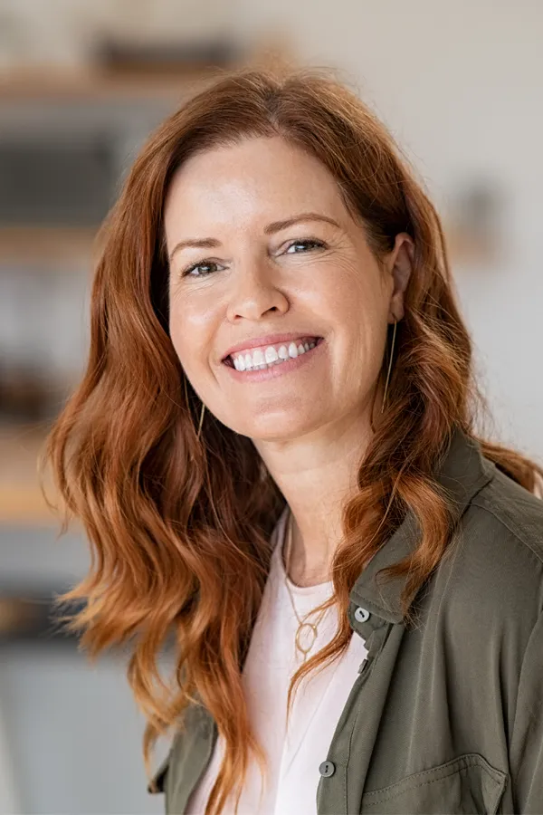 Peptides-for-Hair-Restoration-Treatment A woman with beautiful long red hair smiles due to the success of peptides for hair restoration treatments from Healthy Aging Medical Centers of New Jersey in Northern New Jersey.