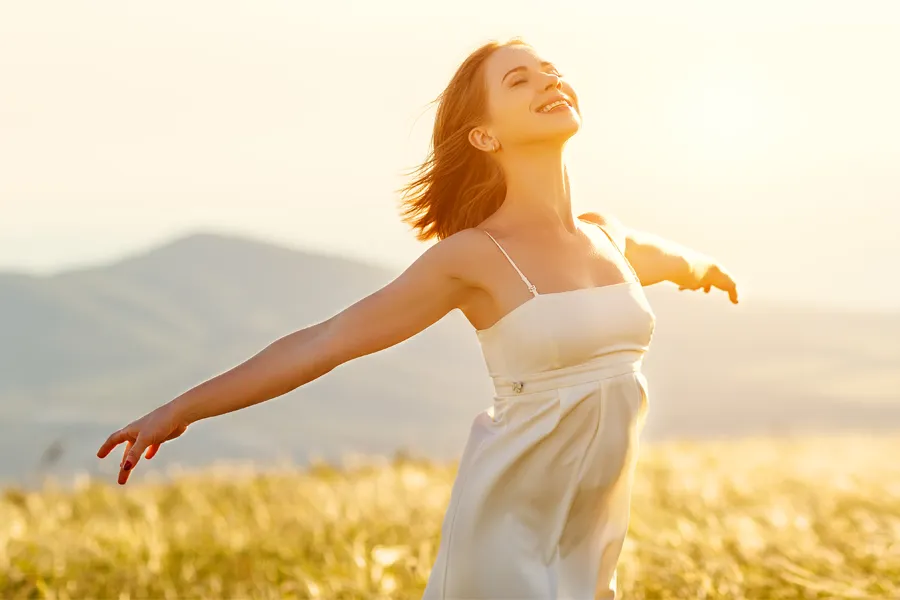 Radiofrequency-Microneedling-for-Arms-Clinic A woman with smooth, taut arms stretches them outside. Schedule Radiofrequency Microneedling for Arm skin from Healthy Aging Medical Centers of New Jersey in Northern New Jersey.