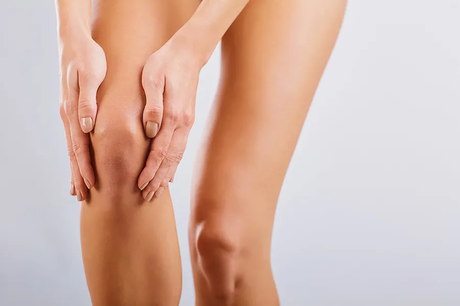 Radiofrequency-Microneedling-for-Knees-Clinic A woman displays her knees. Schedule Radiofrequency Microneedling for Knee Skin Treatment from Healthy Aging Medical Centers of New Jersey in Northern New Jersey.